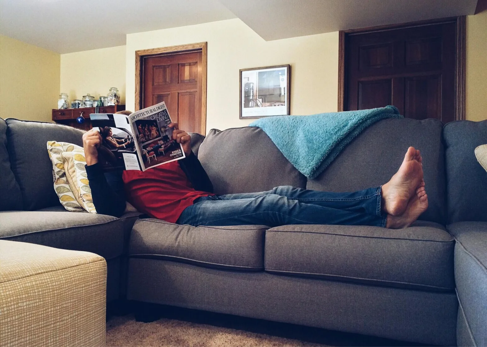 woman lying on sofa